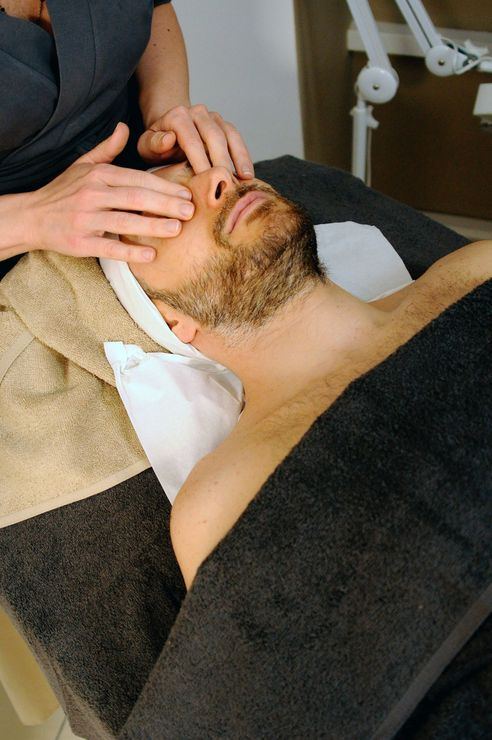 Hands providing careful therapeutic support